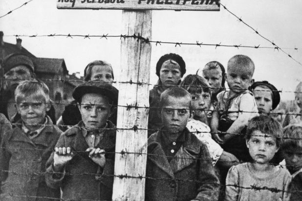 Children in a World War II concentration camp, circa 1943 / Getty Images